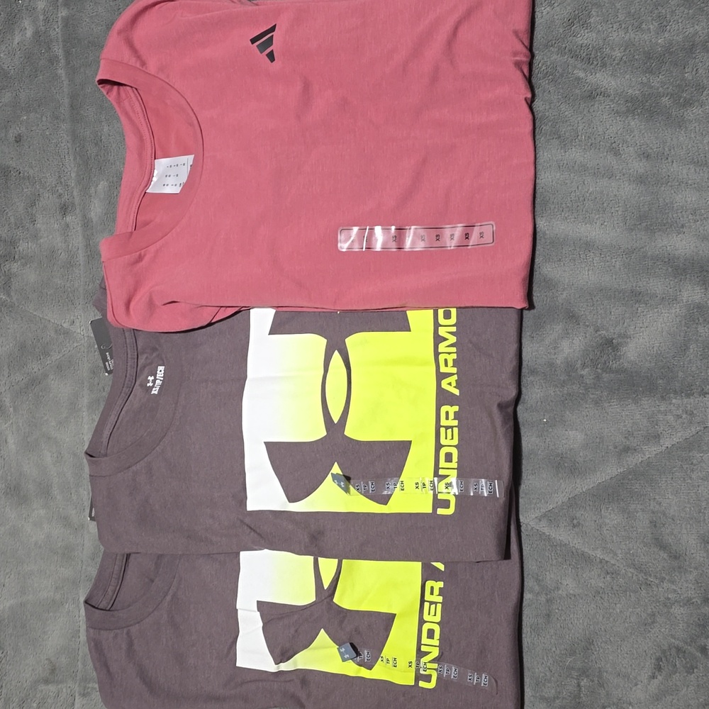 3 Shirts. 2 Under Armour Greyish/purple 1 Adidas Pinkish